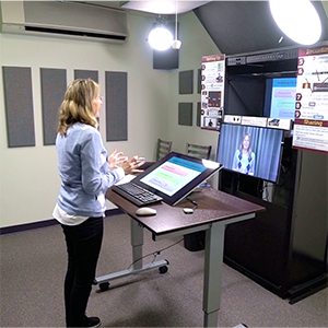 An instructor records a lecture in the CIS Video Maker Space