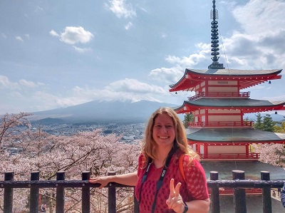 Aimee Miller smiling for the camera while on a trip in Japan.