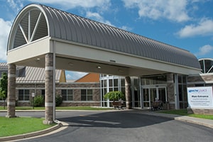 The main entrance of HealthSource Saginaw, a short, long building.
