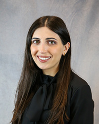 Headshot for Denise Mourad wearing a black top.