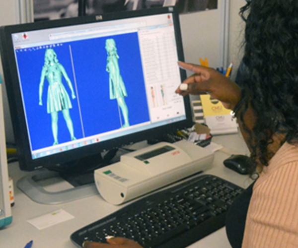 Fashion student reviewing a 3D body scan on a computer