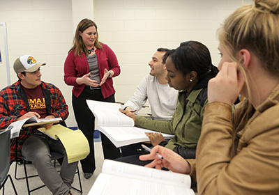 Dr. Emma Powell with students seated in a classroom