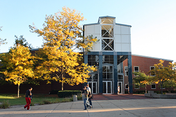 Students walking in front of the Engineering and Technology building in the fall.