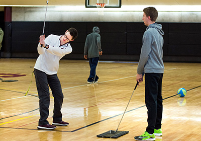 PES students practicing golf swing