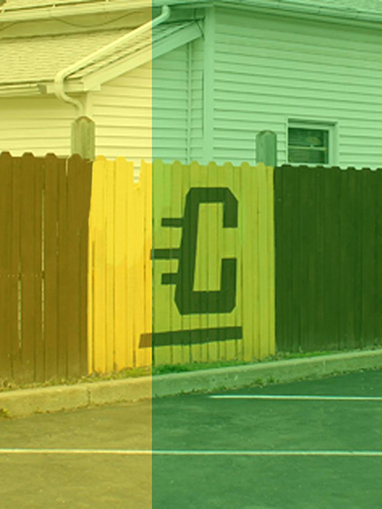 Flying C painted on fence