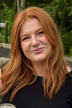 A headshot of SI Leader, Ashlynn Wrona, posing outdoors