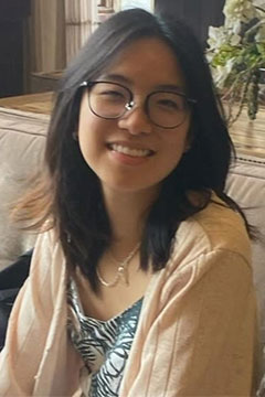 A photo of SI Leader, Hahn Lee, seated on a couch. 