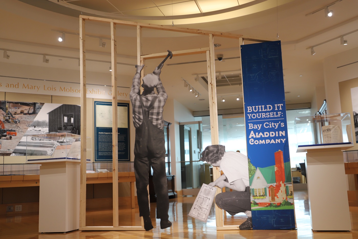 View of the Clarke's exhibit, showing a frame for a wall being constructed.