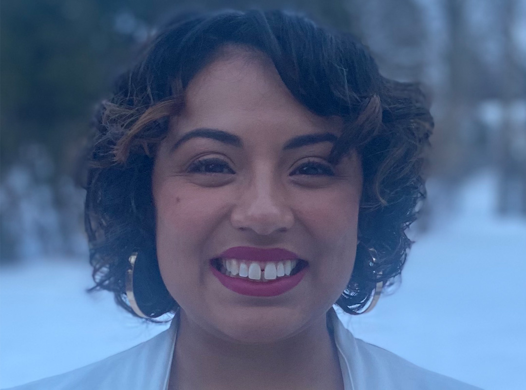 In wintertime, a Casual close-up outdoor headshot of Delia Fernandez-Jones from the Department of History at Michigan State University.