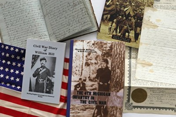 Collection of writings and images from the civil war era laid out on top of one another.