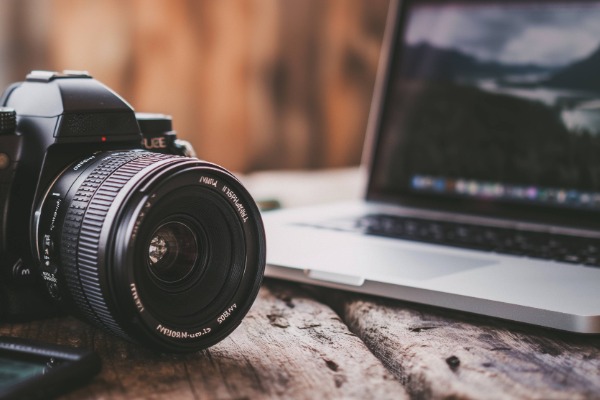 photo of a camera and macbook laptop