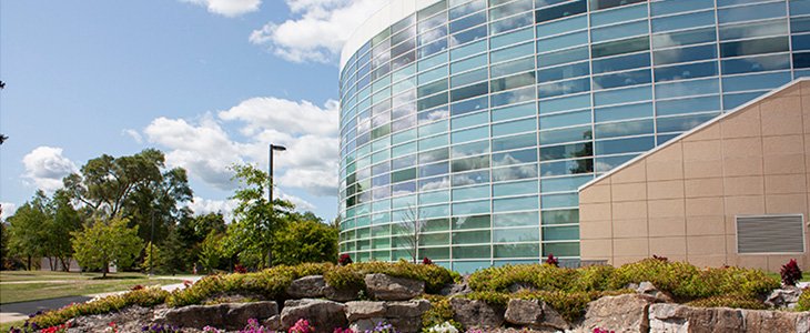 Outdoor image of Park Library with trees and flowers