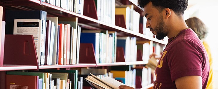 2023_02_20 Student in bookstacks 730x300