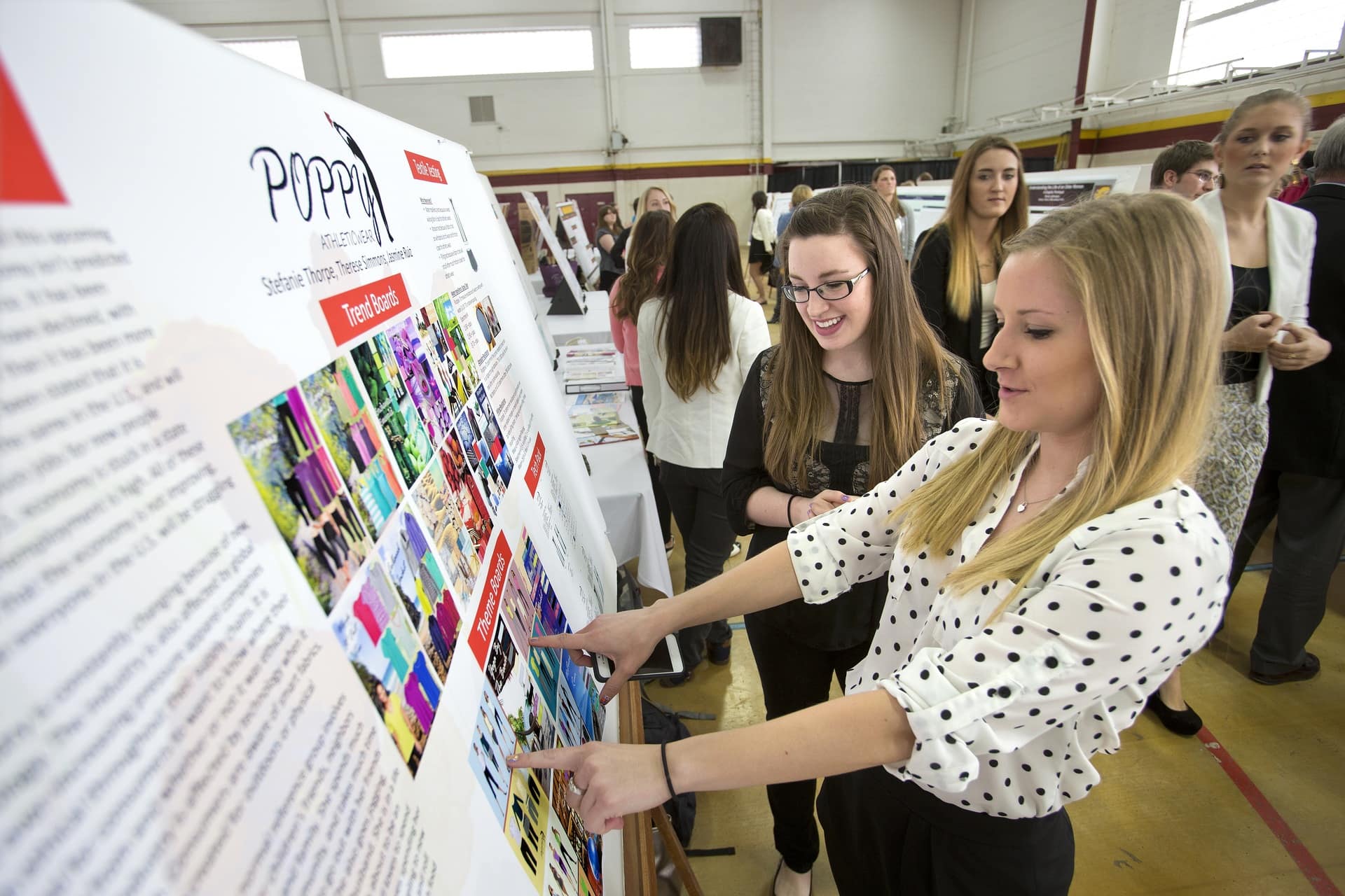 Students display their research on a poster