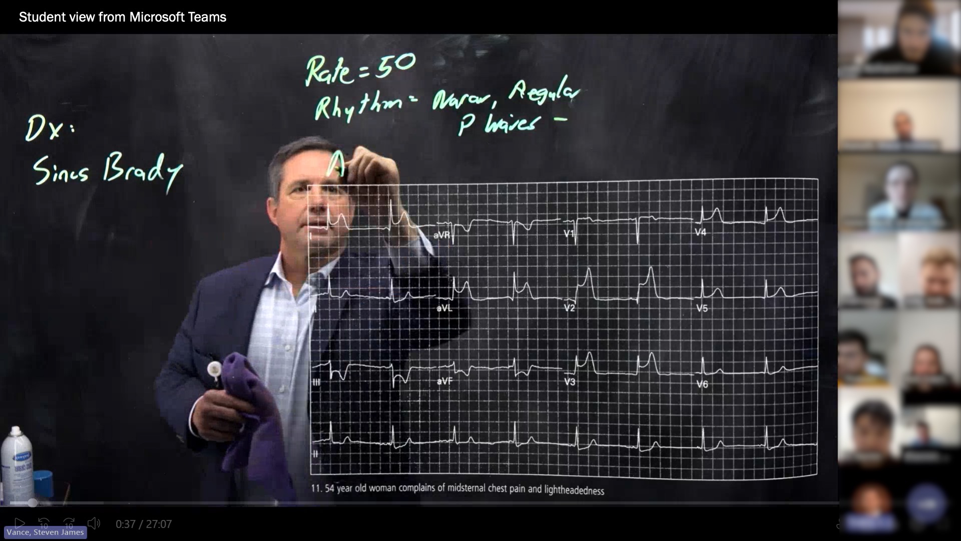 Steve Vance annotates an EKG on the Lightboard while his students watch on Microsoft Teams
