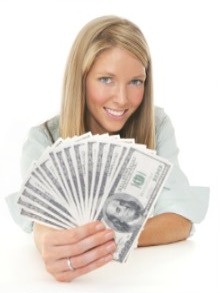 Stock photo of a woman holding dollar bills.