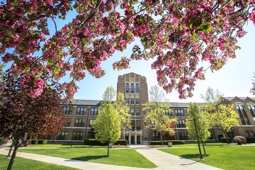 Warriner Hall with blossoms in front of it.