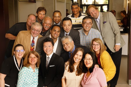 A group of Central Michigan University faculty members smiling for a group photo.