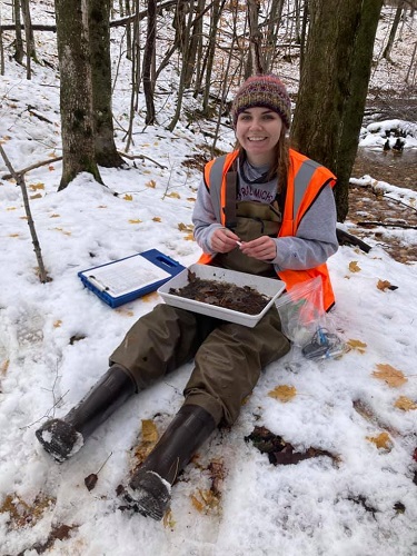 Picture of Amber Hubbard doing research in a Michigan swamp