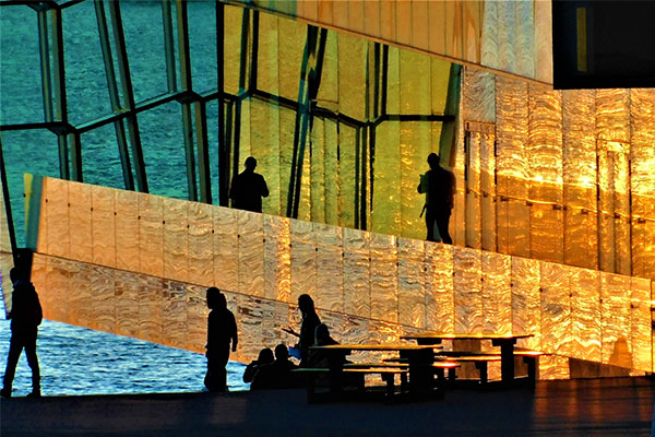 Individuals walking during a sunset in Iceland.