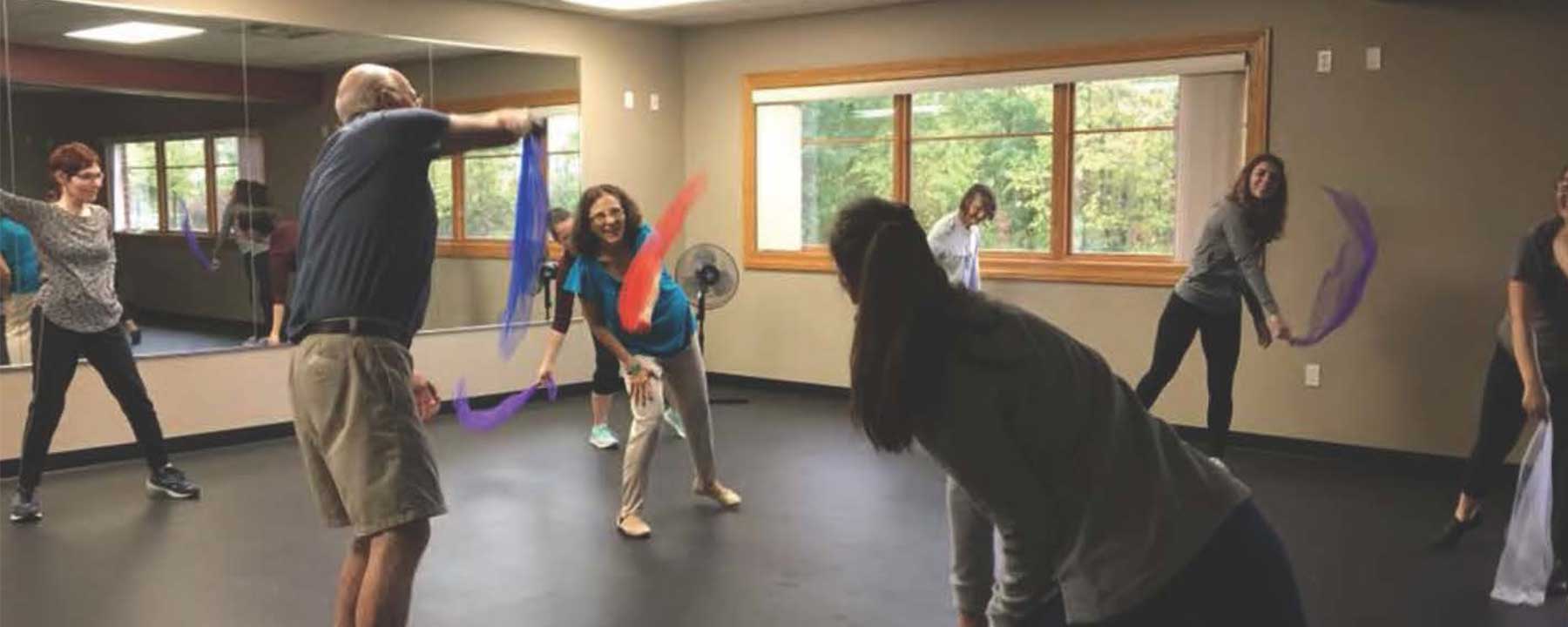Picture of dance class with elderly individuals.