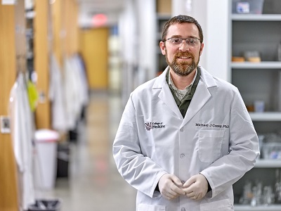 Michael Conway wearing lab coat