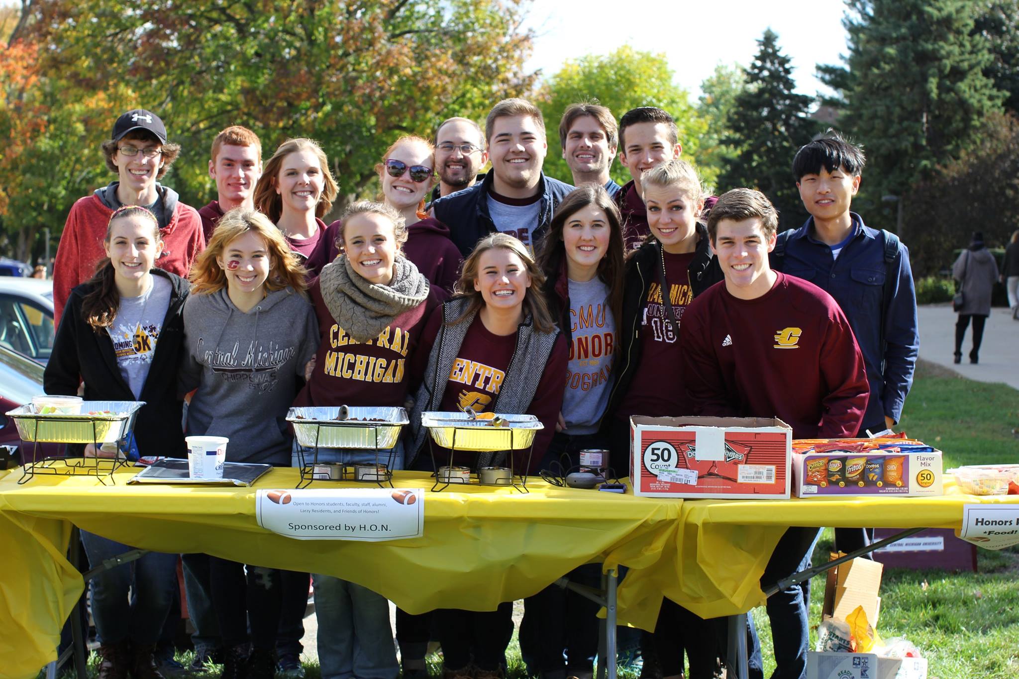 A group of Honors Outreach Network students smiling at the camera while fundraising.