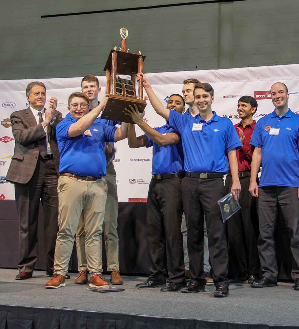 First place ERPsim team holding up a trophy