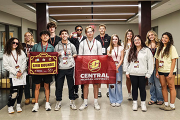 Incoming Central Michigan University College of Business students pose together in Grawn Hall during orientation