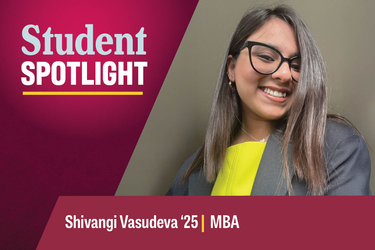 Shivangi Vasudeva smiles brightly at the camera in a gray blazer, neon yellow shirt and black glasses.