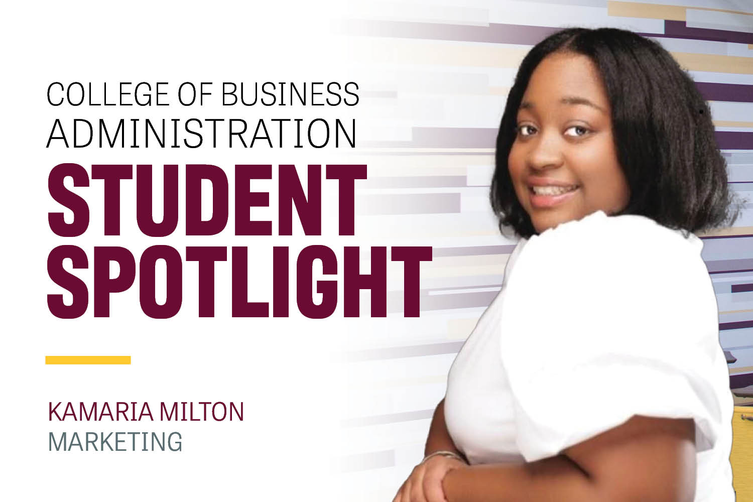 Kamaria Milton wears a white shirt and sits in a black leather chair. She has her arms clasped to the side and she's posed looking back over her shoulder with a big smile. The background is dark.