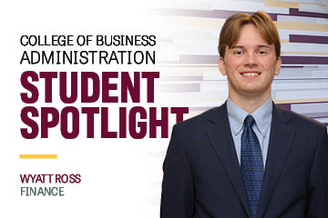 Image text: College of Business Administration Student Spotlight Wyatt Ross Finance. Image: Wyatt Ross wears a blue suit, shirt and tie. He has reddish hair that is parted in the center.