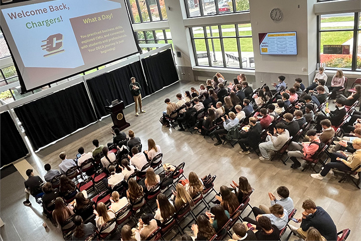 Anthony Niemiec presents to students during Dow High School's DECA Day