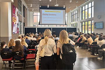 Two students at Dow High School's DECA Day hosted by the College of Business Administration