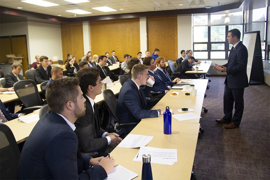 Michigan Finance Scholars meeting in a conference room.