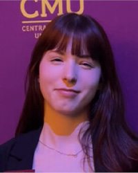 A professional headshot of Arei Yambrick.