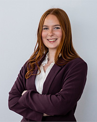 A professional headshot of Emma VanWoert