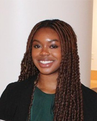 A professional headshot of Kennedy Ray