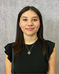 A Professional headshot of Perla Rosas.