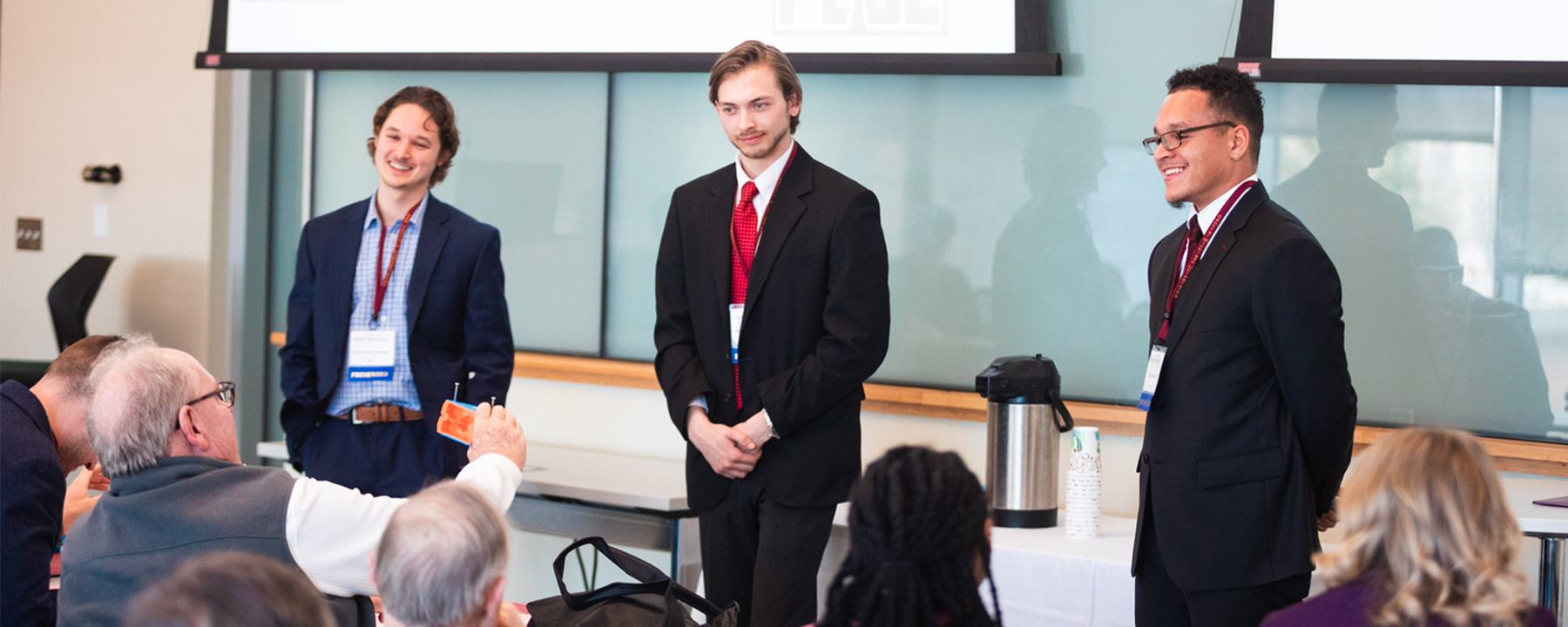 New Venture Challenge Team Peble presenting their business venture idea to a panel of judges
