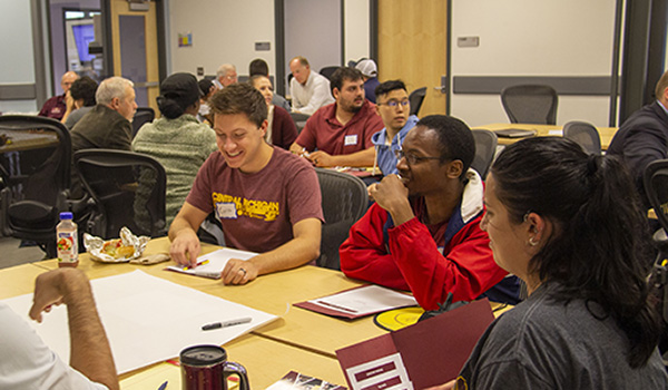 CMU students working together at a New Venture Competition Workshop