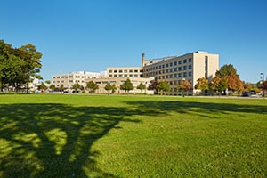 Covenant Healthcare building on a sunny day from afar.