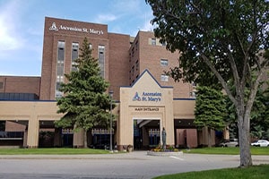 The entrance of Ascension St. Mary's, a large brown building.