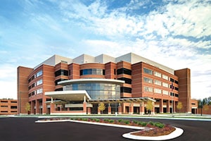 MidMichigan Health, a large building containing many windows.