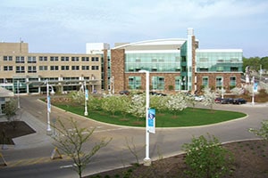 Spectrum Health Lakeland, a tan and brick building filled with windows.