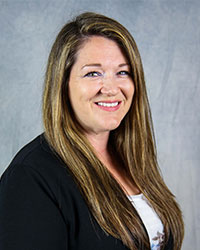 a woman with long hair smiling