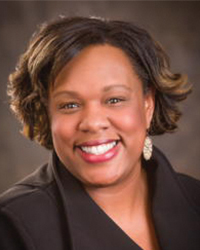 Headshot of Delicia Pruitt wearing a black blazer.