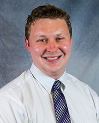 Headshot of Jacob Boersma wearing a white shirt.