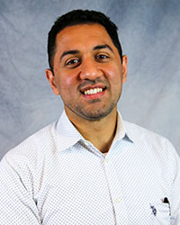 Headshot of Mohammad Shaear wearing a white shirt.