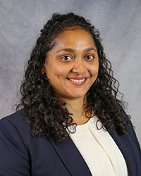 Headshot of Shravani Sripathi wearing a blue blazer and white top.